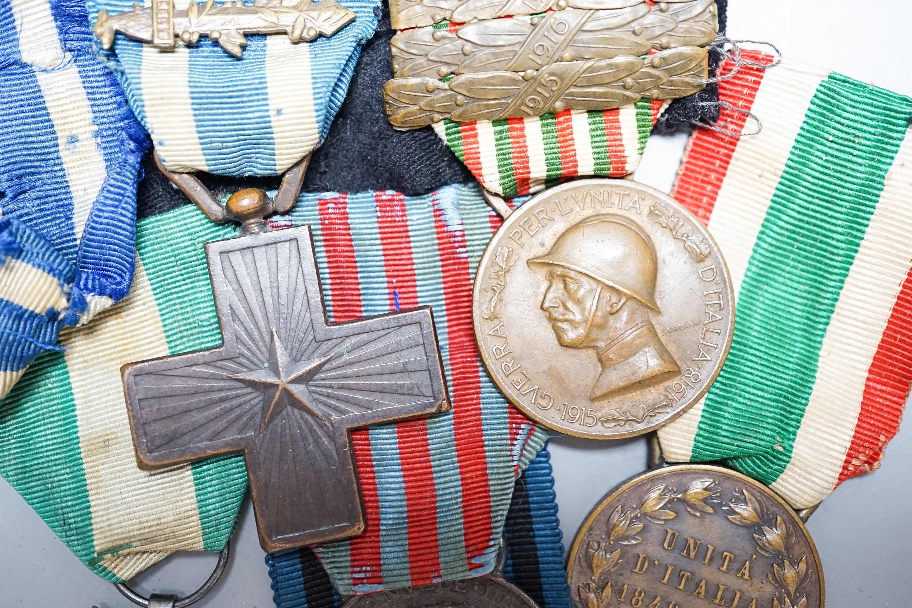 An Italian WWI medal group of six, including War Cross, War of Italian independence 1915–18 with four clasps, Libya 1911, United Italy 1848-1918, Ethiopian campaign 1935 and Army long service medal